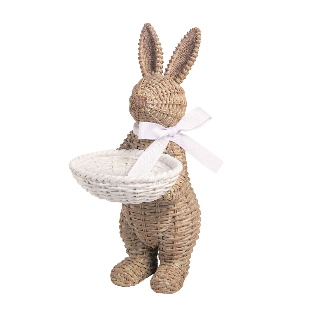 Wicker bunny holding a basket on a white background
