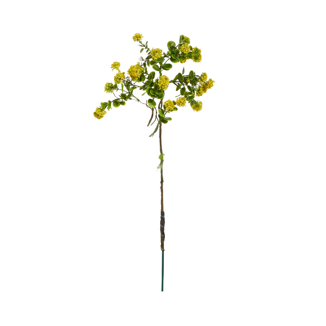 Artificial plant stem with yellow flowers on a white background
