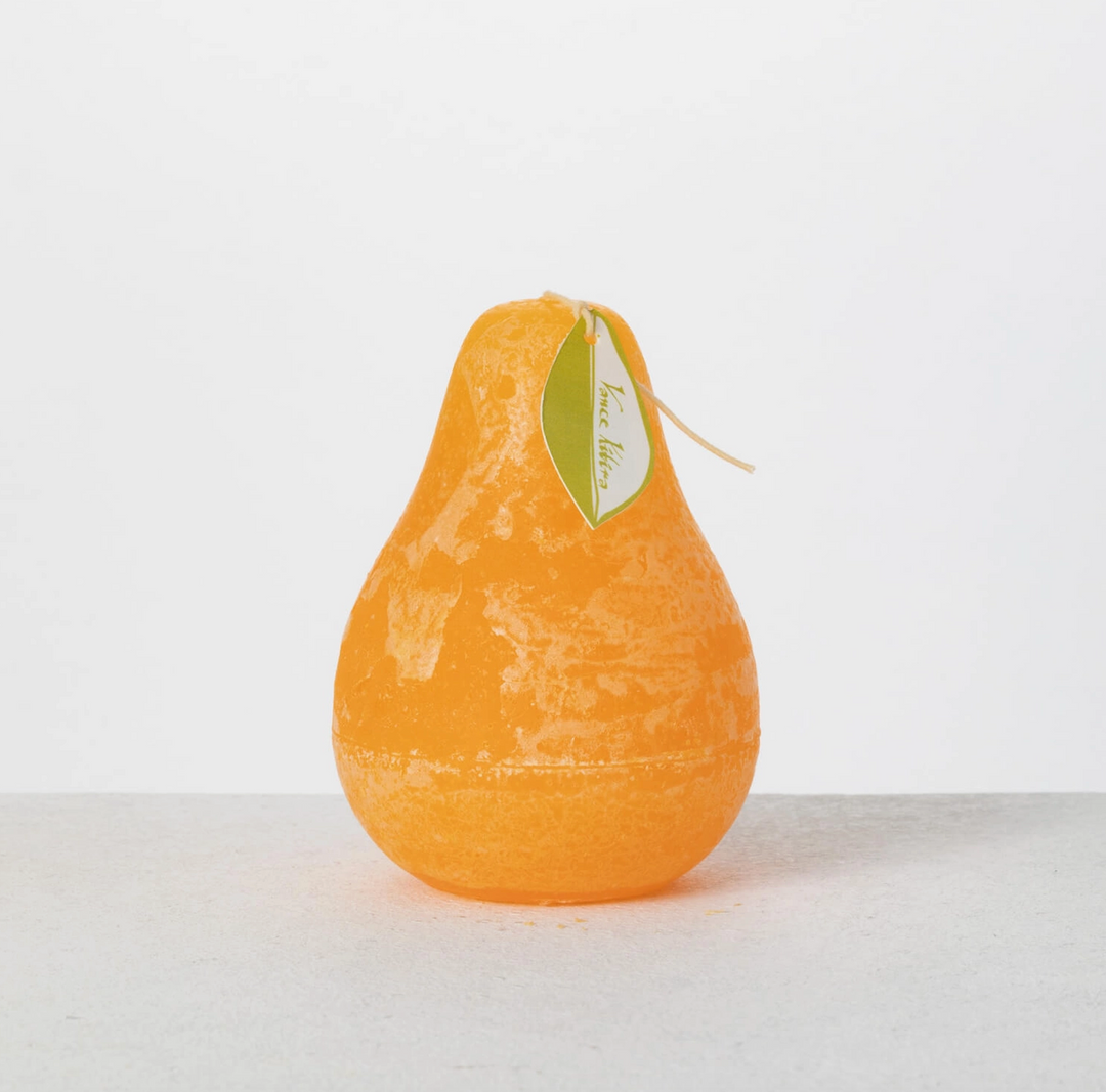 Yellow Pear-shaped candle on a white background