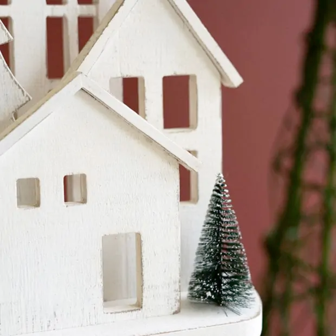 White Wooden Christmas Village On Pedestal