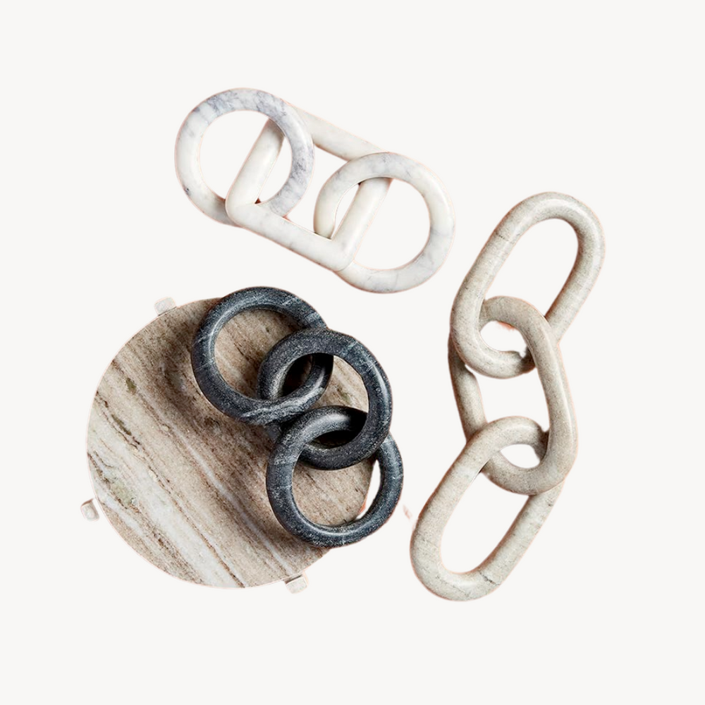 Three links of a marble decor set in assorted colors and shapes 
